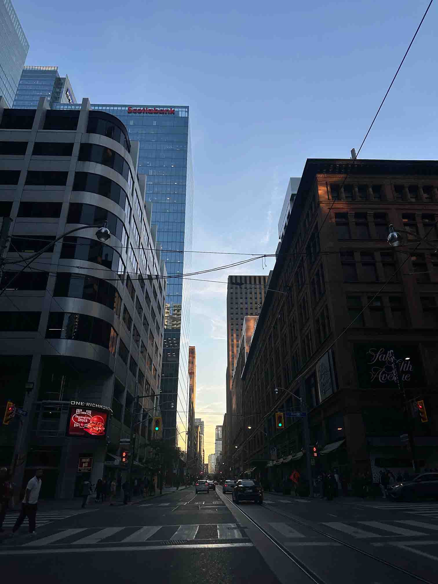 Street-level view of Toronto buildings and streetcar tracks